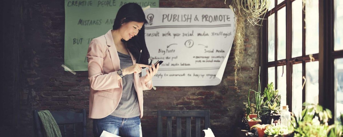 marketing professional smiling at her phone