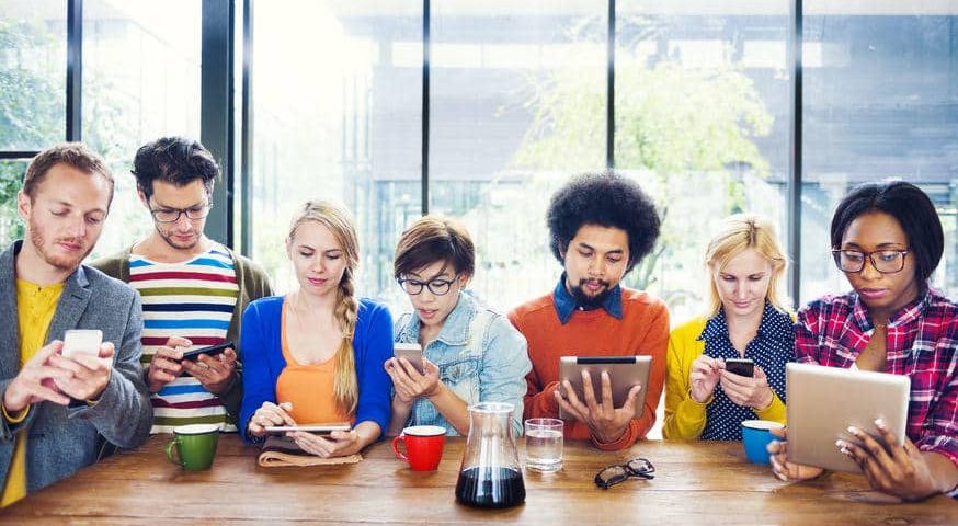group of people looking at mobile devices