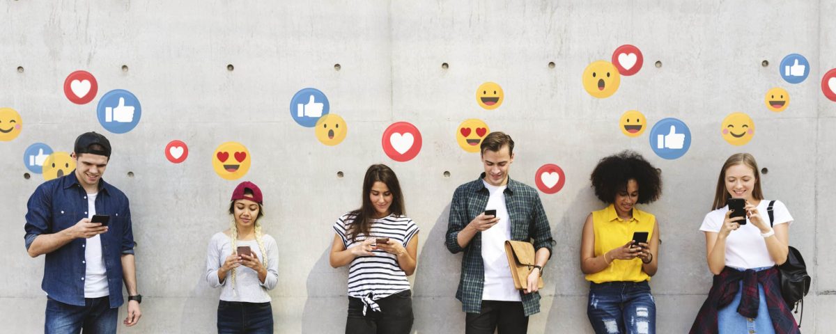 Young people looking at social media on their phones