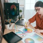 a graphic designer working on her brand’s color palette