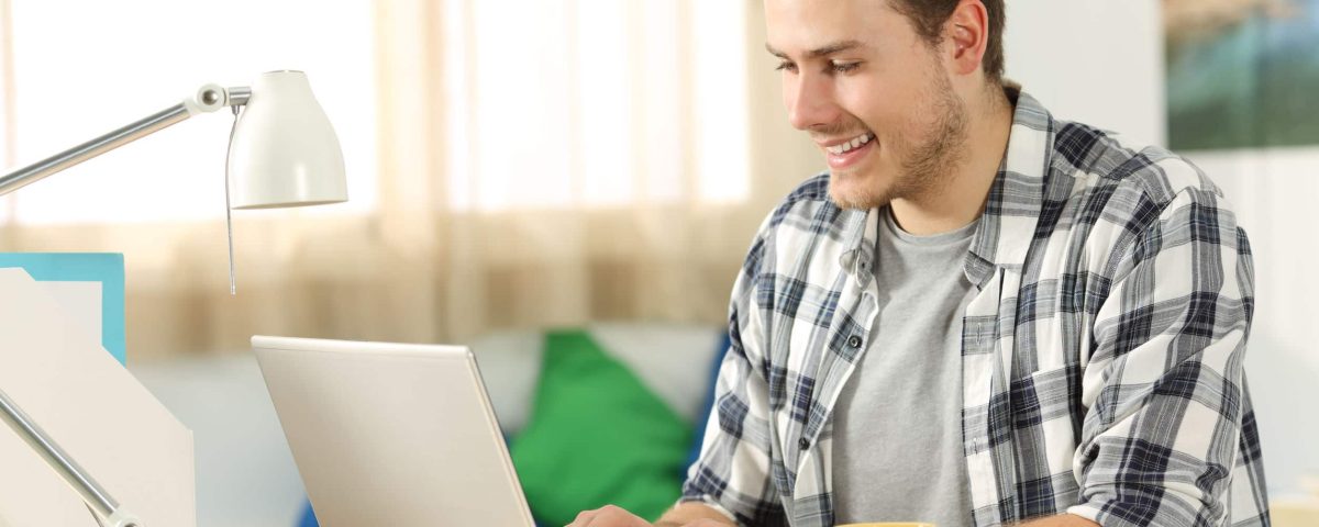 a man seeing an ad on his laptop while working from home